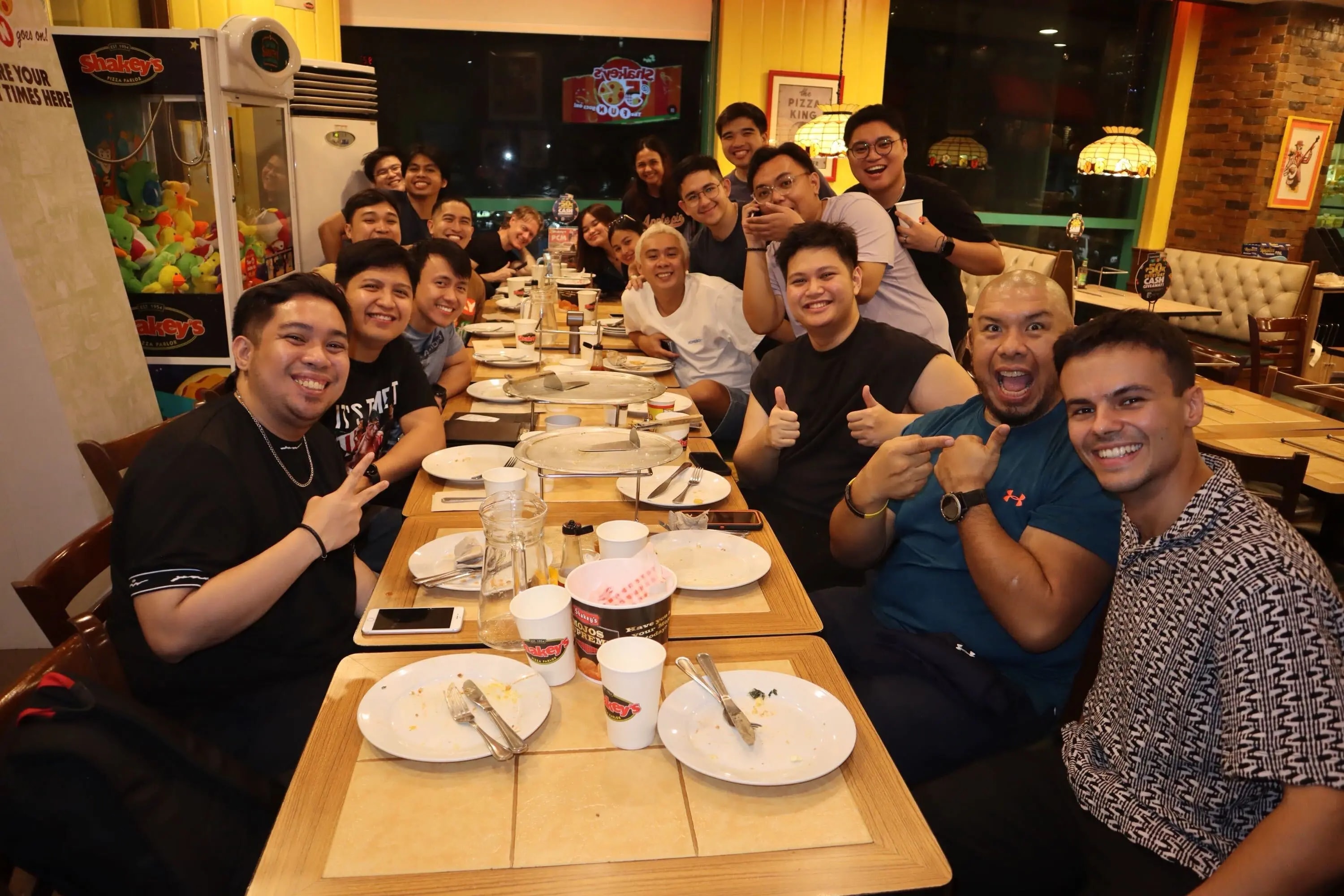GoRocky teammates smiling together around a restaurant table