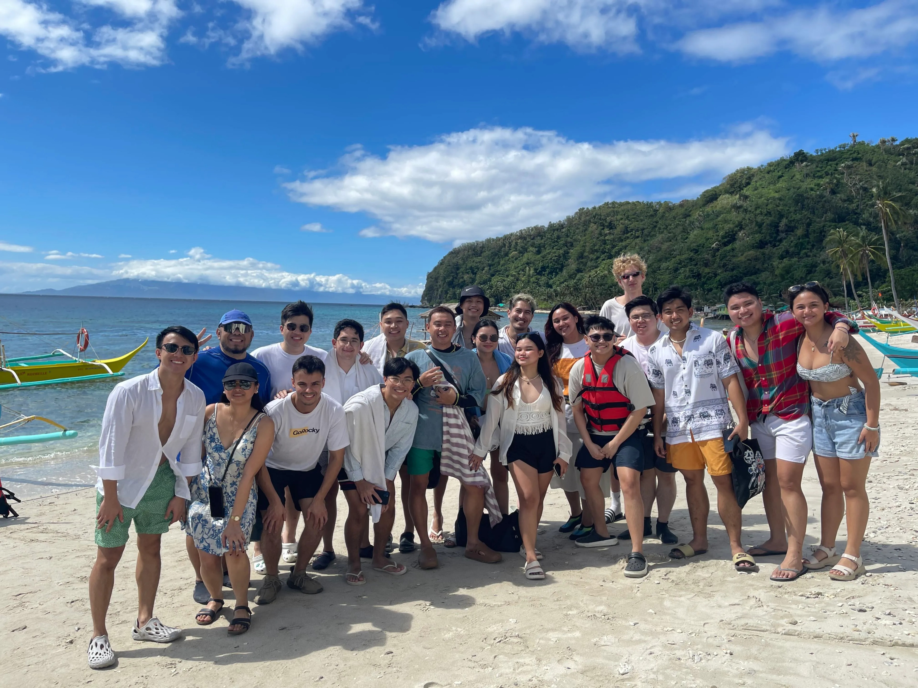 The GoRocky team smiling together during a beach trip