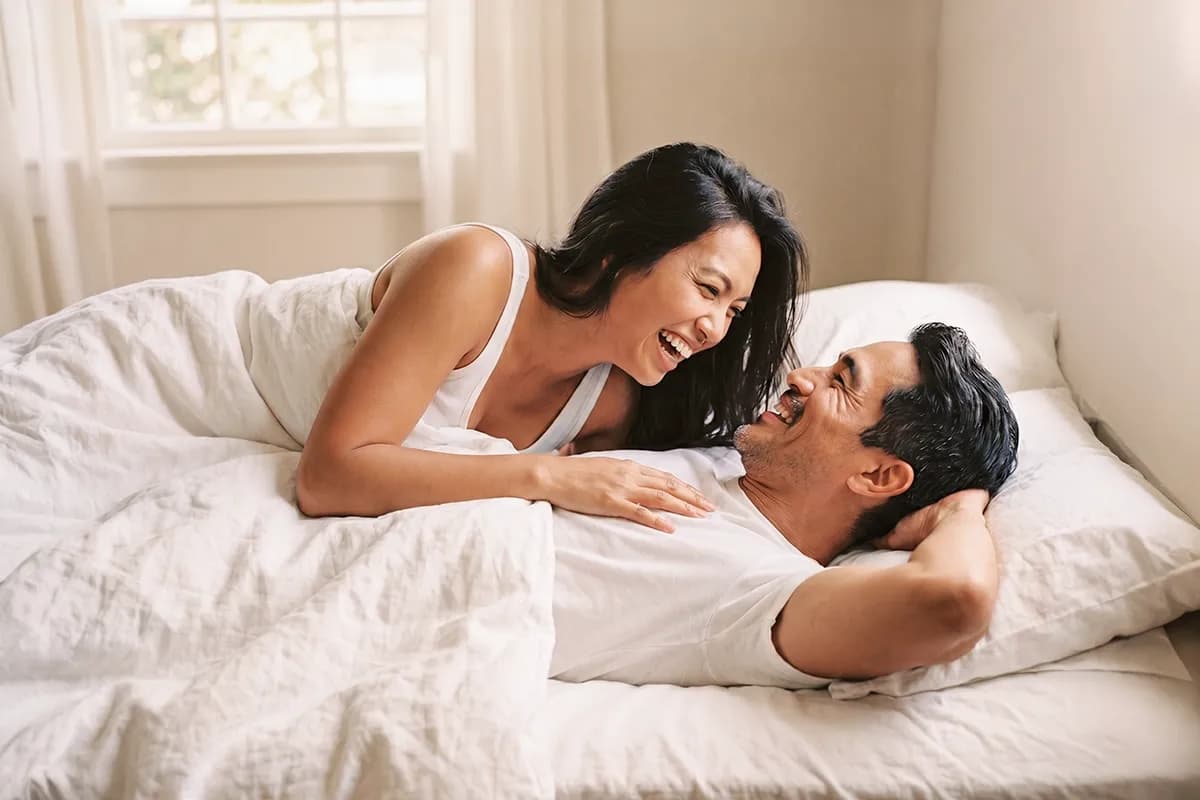 A couple in bed after enjoying the effects of using GoRocky ED treatments.
