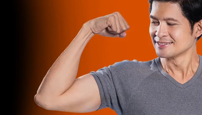 Person checking waistline with tape measure